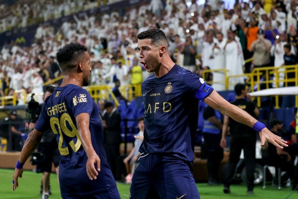 Ronaldo shushed the visiting team's fans who were shouting Messi. AFP