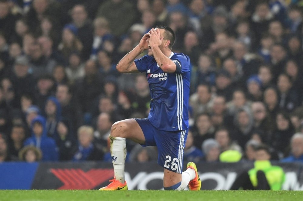 Chelsea's defender John Terry reacts after he is penalised for a challenge on Peterborough. AFP