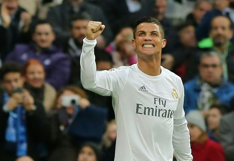 Real Madrids Cristiano Ronaldo celebrates after scoring during the Spanish league match against Real Sociedad at the Santiago Bernabeu stadium on December 30, 2015