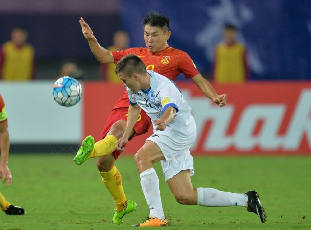 China's Yu Hanchao in action against Uzbekistan. AFP