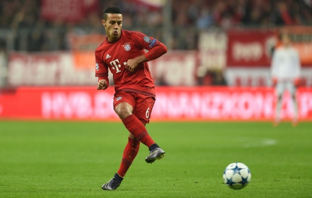 Bayern Munichs Thiago Alcantara takes a swing during the match against Arsenal in Munich, southern Germany, on November 4, 2015