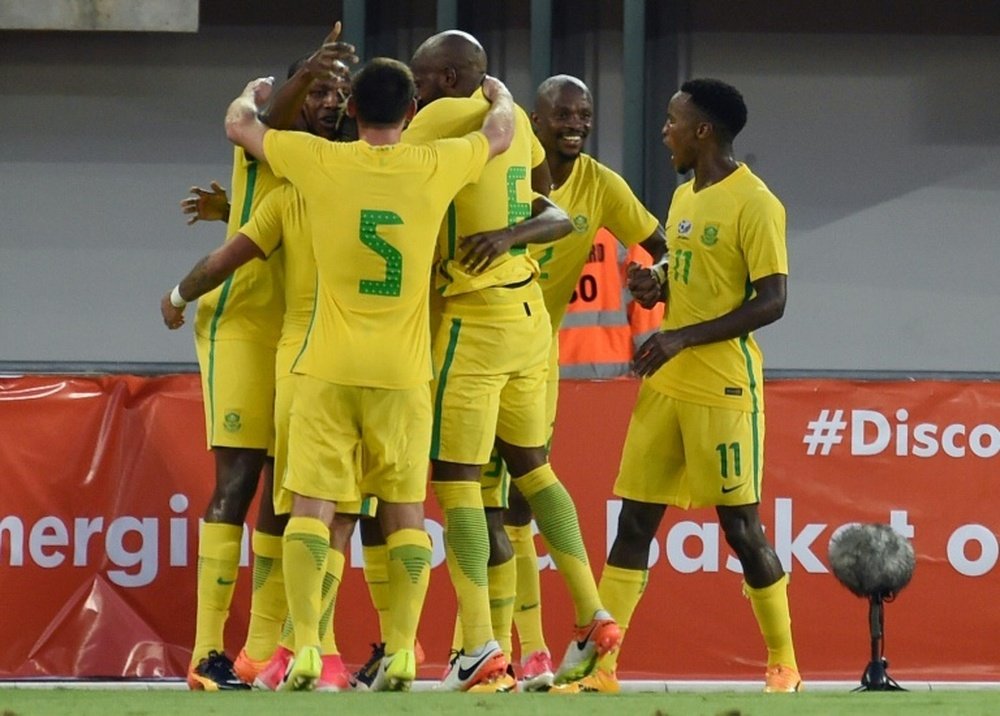 Members of the South African national football team celebrates a goal during the 2019 African Cup of Nations qualifyer football match against Nigeria at Goodswill Akpabio International Stadium on June 10, 2017