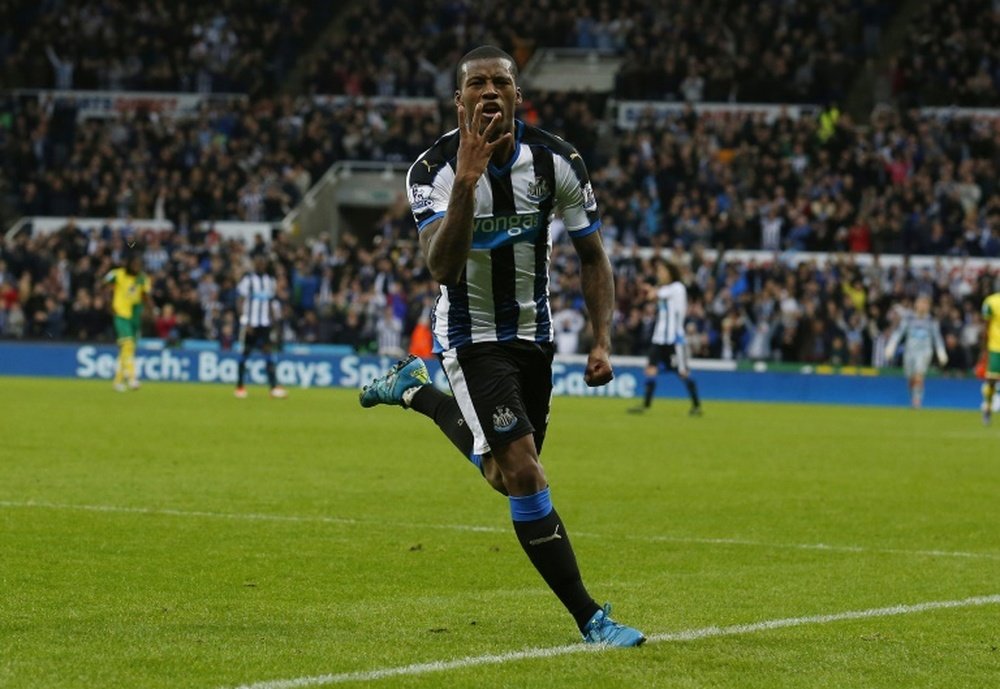 Newcastle Uniteds midfielder Georginio Wijnaldum celebrates after scoring his fourth goal, Newcastles sixth, during an English Premier League football match against Norwich City at St James Park on October 18, 2015
