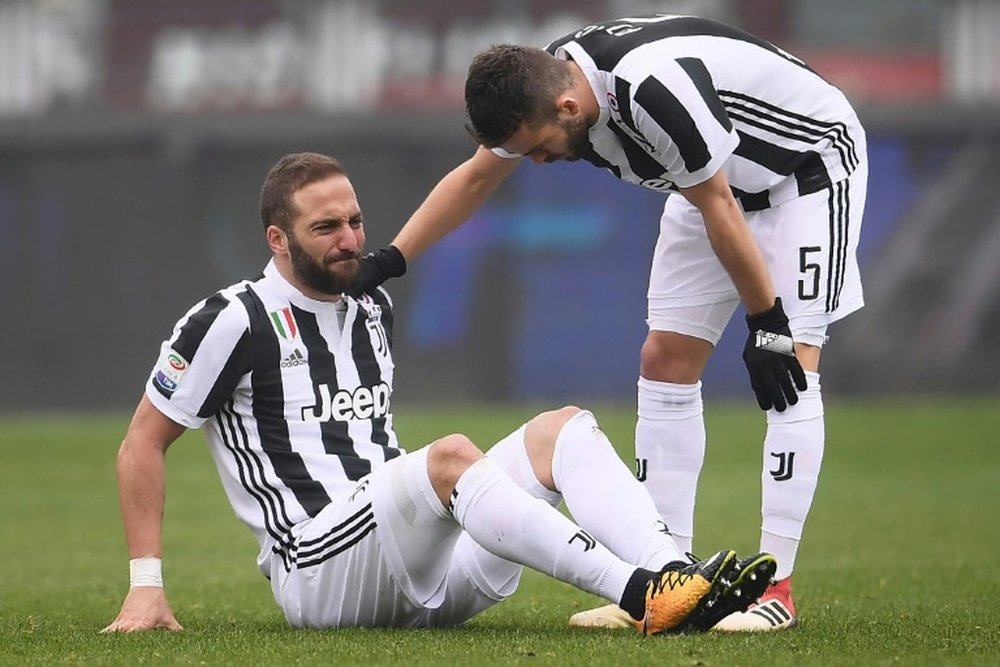 Higuain, Bernardeschi blow for Juventus in bruising derby win. AFP