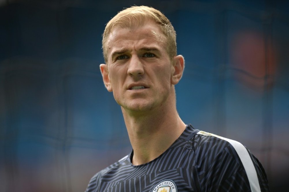 Manchester Citys English goalkeeper Joe Hart warms up before the English Premier League football match between Manchester City and West Ham United at the Etihad Stadium in Manchester, north west England