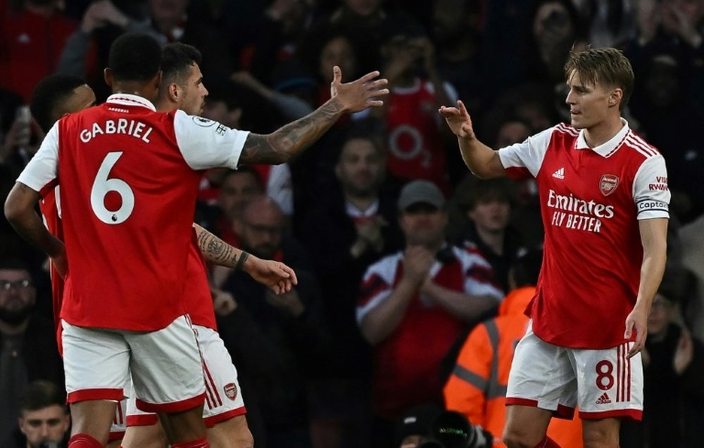 Odegaard (R) scored a brace for Arsenal on Tuesday. AFP