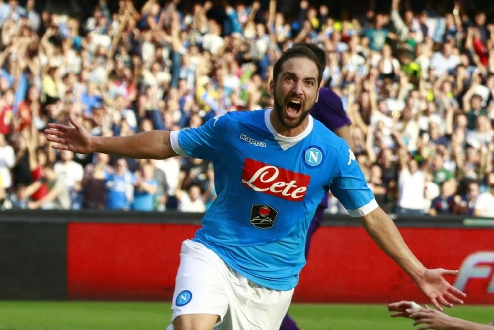 Napolis Argentinian forward Gonzalo Higuain celebrates after scoring during the Serie A match against Fiorentina at the San Paolo stadium in Naples, southern Italy on October 18, 2015