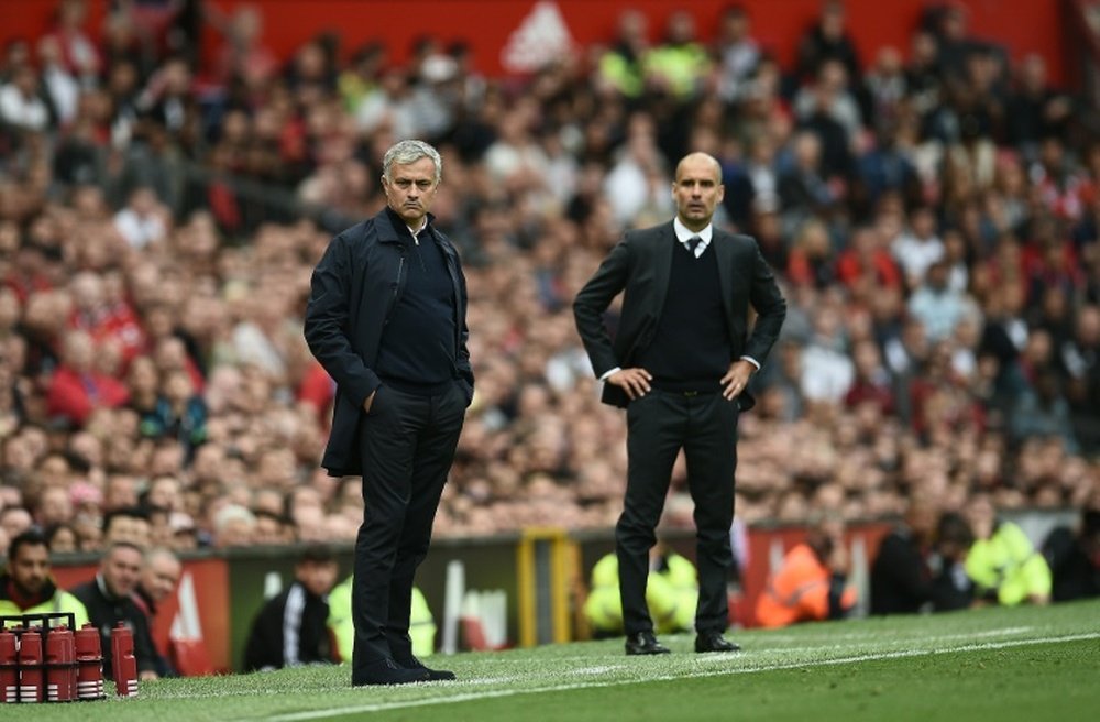 Guardiola and Mourinho fight to dominate Manchester. AFP