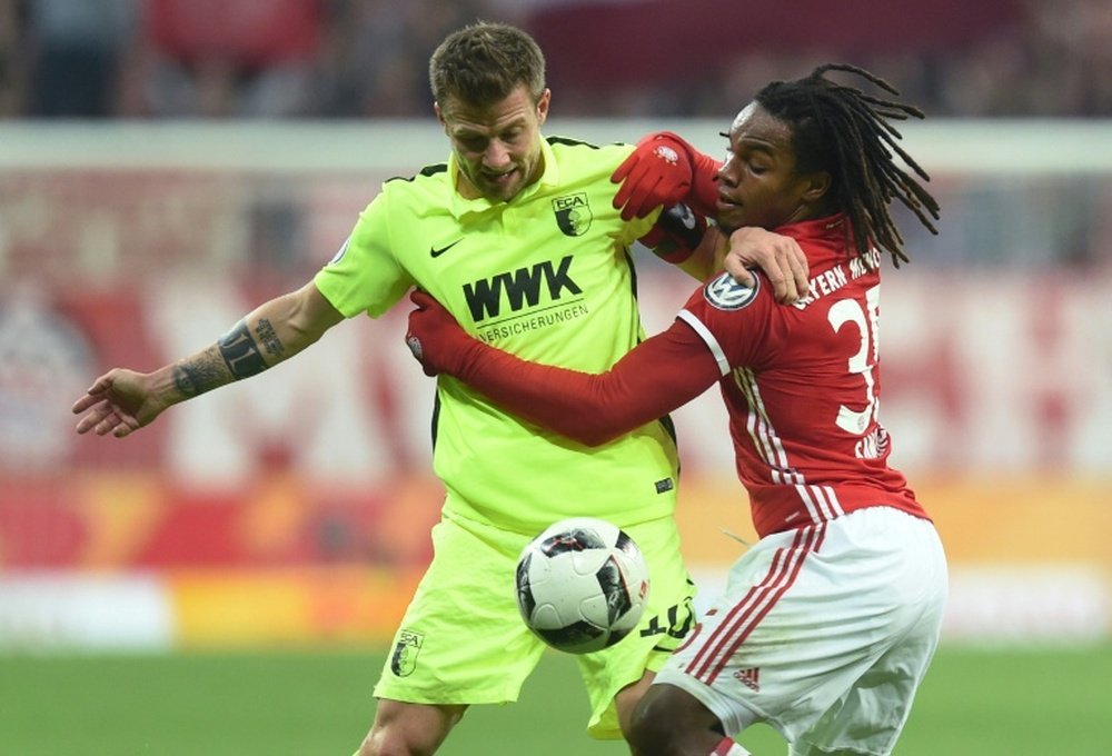Augsburgs Baier & Munichs Renato Sanches push and shove during the match in Munich. AFP