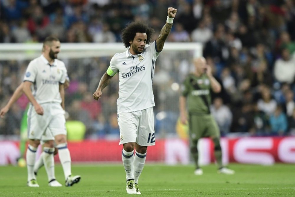 Real Madrids Marcelo celebrates after scoring a goal during their UEFA Champions League Group F match against Legia Warszawa, at the Santiago Bernabeu stadium in Madrid, on October 18, 2016