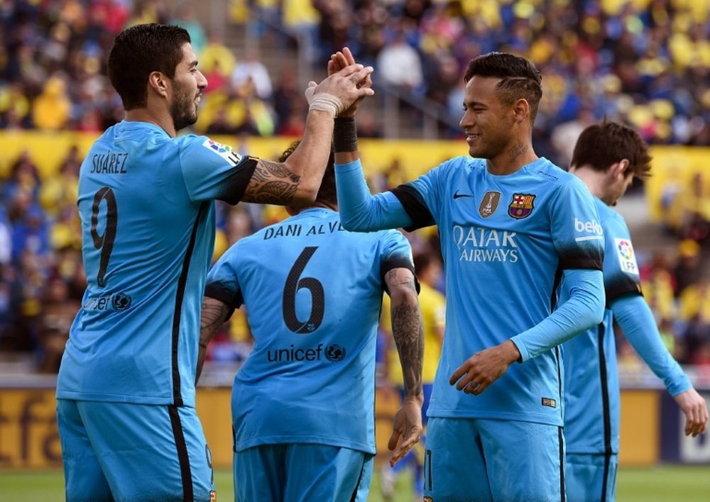 Barcelonas forward Luis Suarez (L) celebrates a goal with Neymar during the Spanish league match at Las Palmas on February 20, 2016