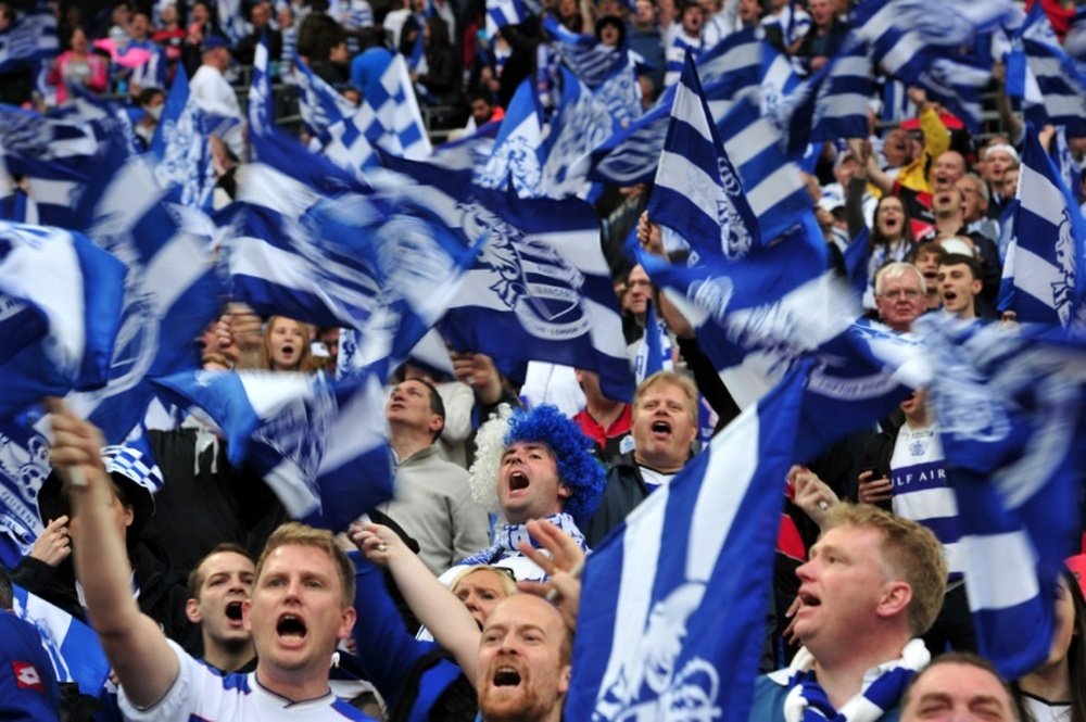 QPR fans cheer for their team during a match at Wembley Stadium in London on May 24, 2014