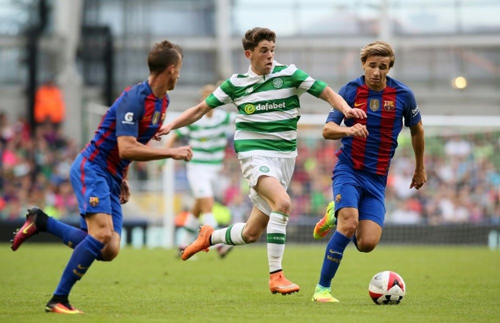 Ryan Christie (C) has held talks with Celtic over a new contract. AFP