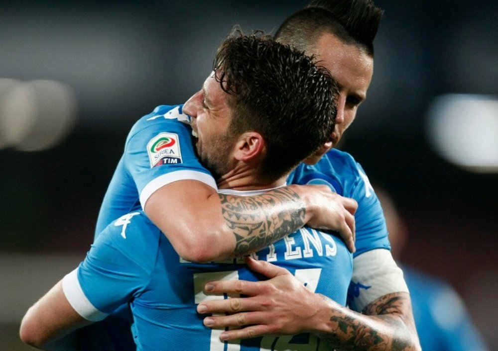 Napolis forward Dries Mertens celebrates after scoring with teammate Marek Hamsik during the Italian Serie A match vs Bologna FC on April 19, 2016