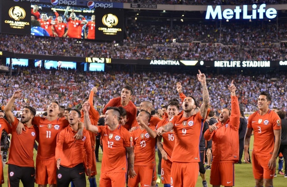 Chiles players celebrate after defeating Argentina in the penalty shoot-out and winning the Copa America Centenario final, in East Rutherford, New Jersey, on June 26, 2016
