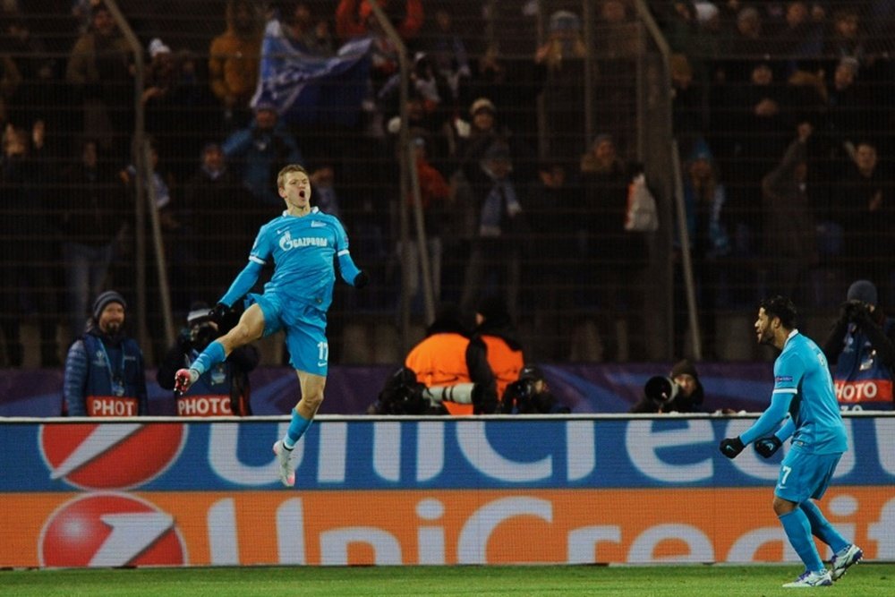 Zenits Russian midfielder Oleg Shatov celebrates after scoring during an UEFA Champions League match against Valencia at the Petrovsky stadium in St Petersburg on November 24, 2015