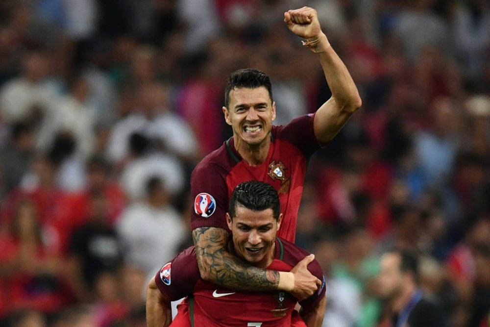 Portugals Cristiano Ronaldo gives a lift to Fonte as they celebrate beating Poland in their Euro 2016 quarter-final match