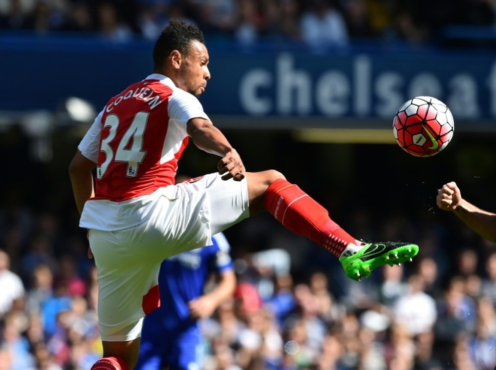 Arsenals midfielder Francis Coquelin jumps for the ball during the English Premier League football match between Chelsea and Arsenal at Stamford Bridge in London on September 19, 2015