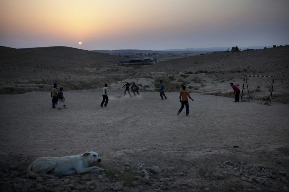 Israeli Bedouin children play football in the village of Abu Tlool. AFP