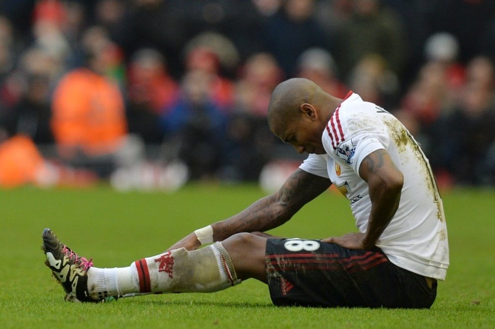 Ashley Young sitting on the pitch. Goal