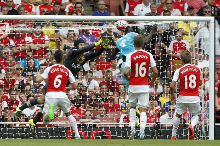 West Hams Cheikhou Kouyate (centre right) heads past Arsenals Petr Cech for the opening goal of the Premier League game at at the Emirates Stadium on August 9, 2015RESTRICTED TO EDITORIAL USE. No use with unauthorised audio, video, data, fixture lists, club/league logos or live services. Online in-match use limited to 45 images, no video emulation. No use in betting, games or single club/league/player publications.