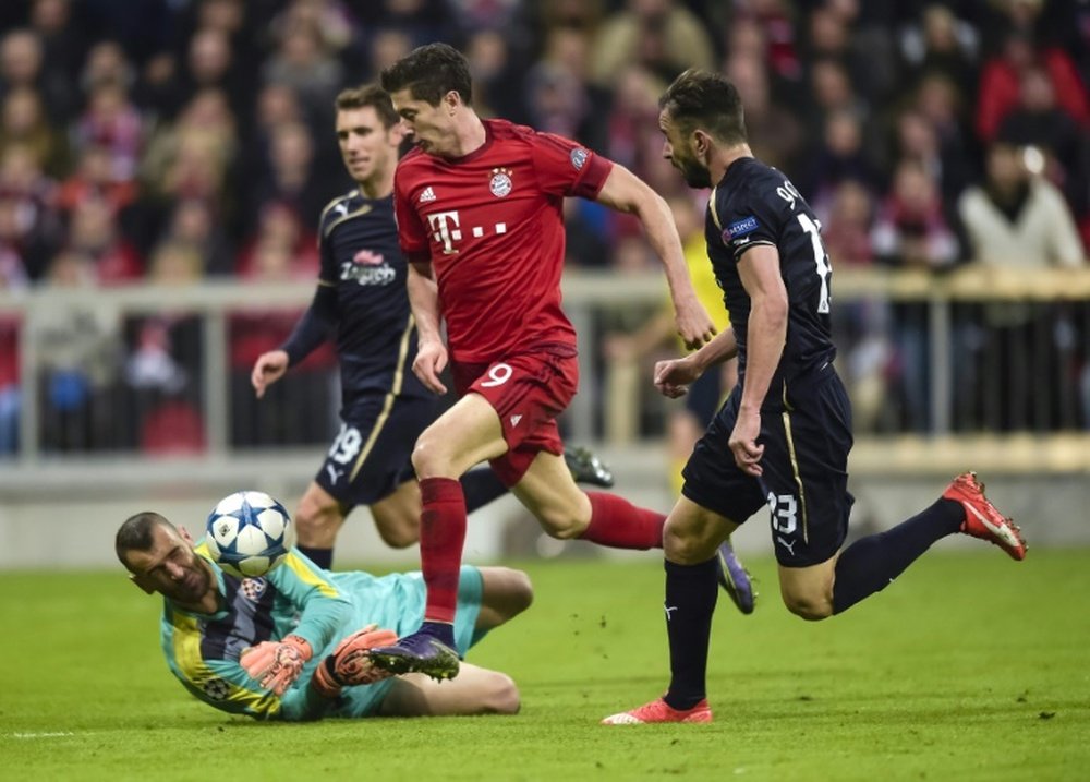 Bayern Munichs Robert Lewandowski (C) grabbed five goals against Wolfsburg last week, two more against Mainz last weekend and claimed a hat-trick in a mid-week win against Dinamo Zagreb in the Champions League