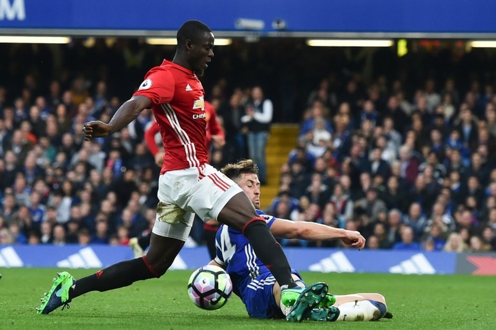 Manchester United defender Eric Bailly collides with Chelsea defender Gary Cahill. AFP