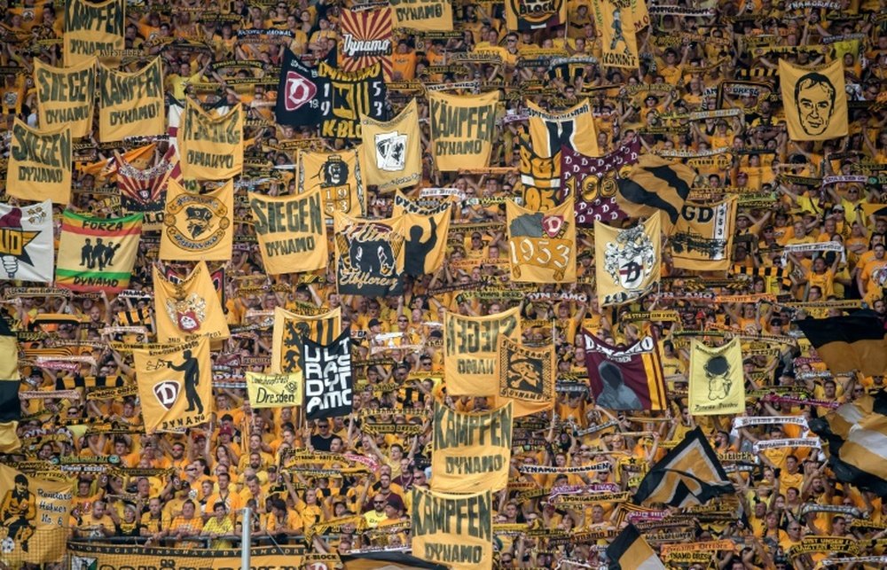 On top of a hefty fine, Dresden must play their next league match in front of 9,000 empty seats. AFP