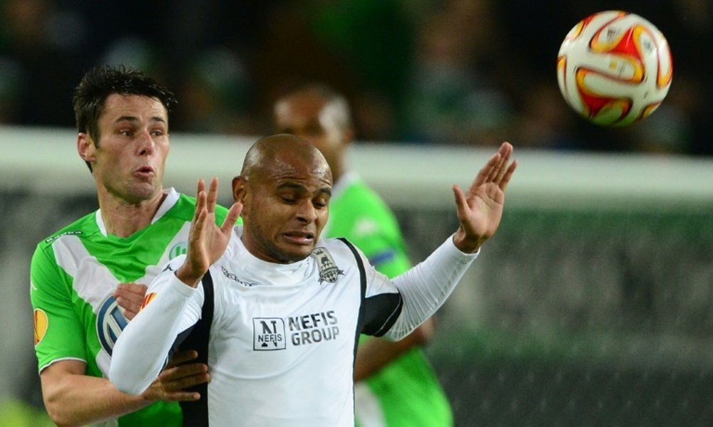 Christian Traesch of Wolfsburg and Ari of Krasnodar (right) vie during the UEFA Europa League match on November 6, 2014 in Wolfsburg