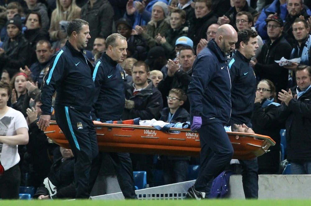 Manchester Citys Argentinian defender Pablo Zabaleta is taken off on a stretcher after suffering an injury during the English League Cup fourth round football match in Manchester, north west England on October 28, 2015