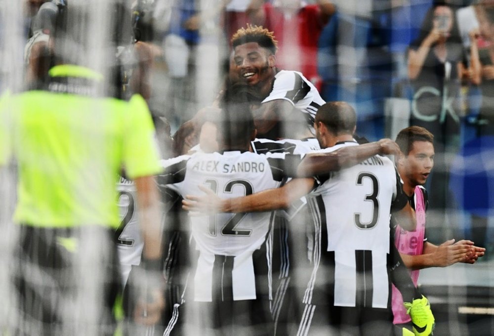Juventus players celebrate after teammate Juventus midfielder from Germany Sami Khedira scored. AFP