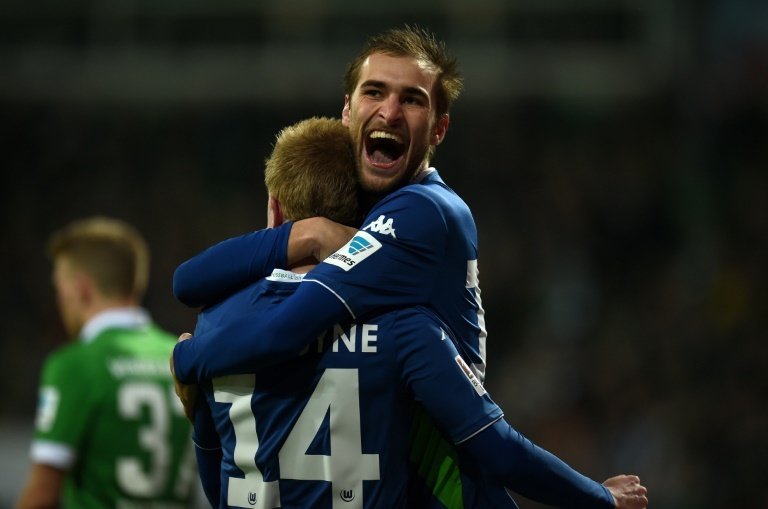 Wolfsburgs Bas Dost (R) and Kevin De Bruyne celebrate during a Bundesliga match on March 1, 2015