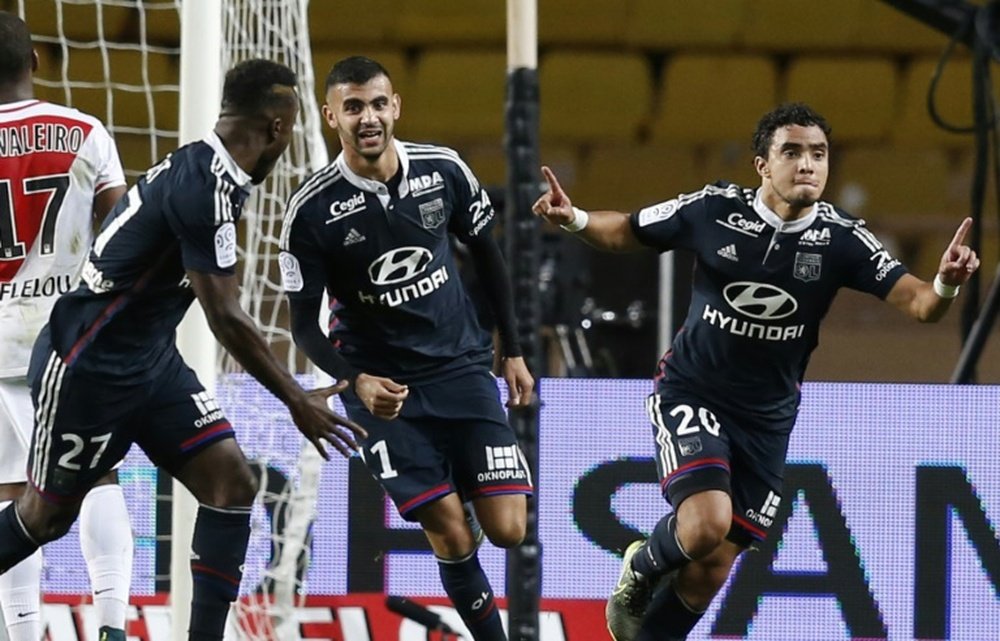 Lyons French defender Rafael Pereira Da Silva celebrates after scoring a goal during the French L1 football match between Monaco (ASM) and Lyon (OL) on October 16, 2015 at the Louis II Stadium in Monaco