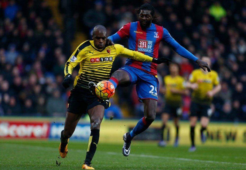 Crystal Palaces striker Emmanuel Adebayor (R) vies with Watfords defender Allan Nyom (L) during the English Premier League match at Selhurst Park in south London on February 13, 2016
