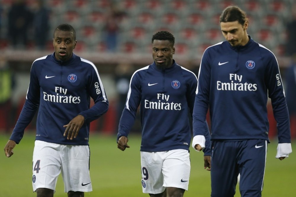 PSGs midfielder Blaise Matuidi (L), defender Serge Aurier (C) and forward Zlatan Ibrahimovic warm up prior to the French L1 football match Nice vs Paris Saint-Germain on December 4, 2015 in Nice, France