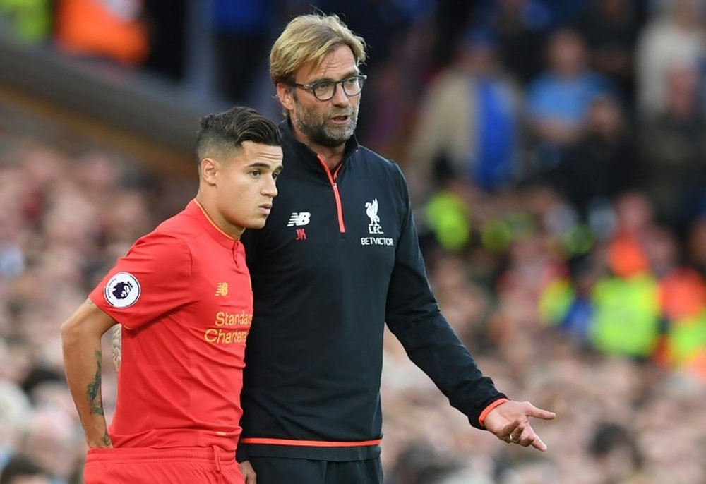 Liverpool's Philippe Coutinho with manager Jurgen Klopp. AFP