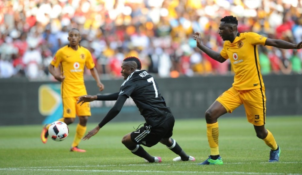 The two deaths occured when Kaizer Chiefs (in yellow) took on Orlando Pirates in Johannesburg. AFP