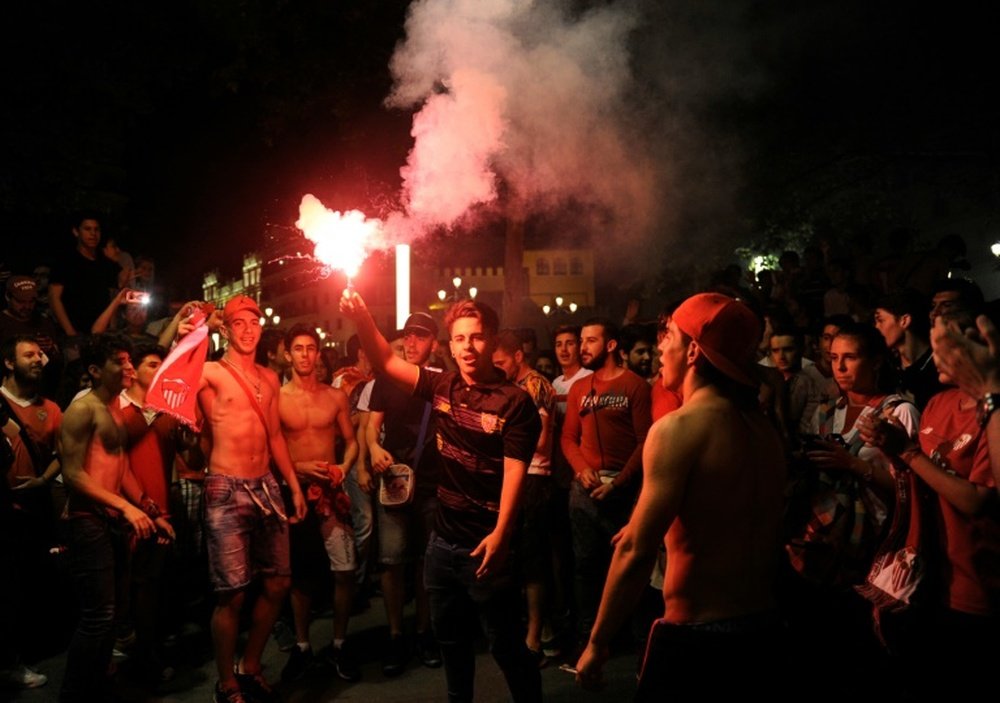Sevilla football team supporters celebrate in Seville after their team beat Liverpool 3-1
