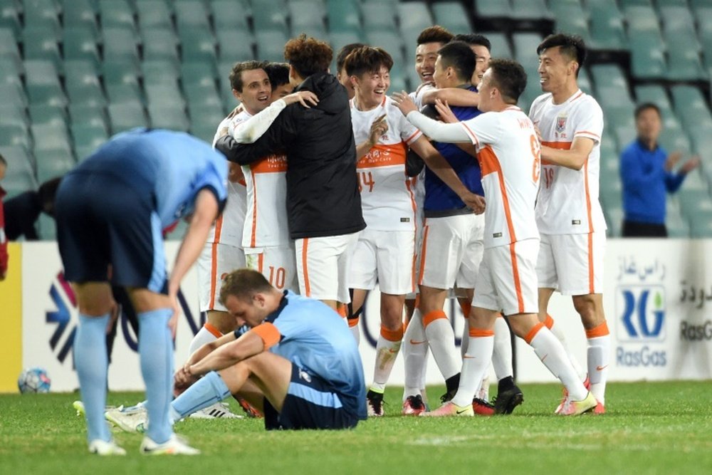 Shandong Luneng celebrate qualification for the AFC Champions League quarter-finals. BeSoccer
