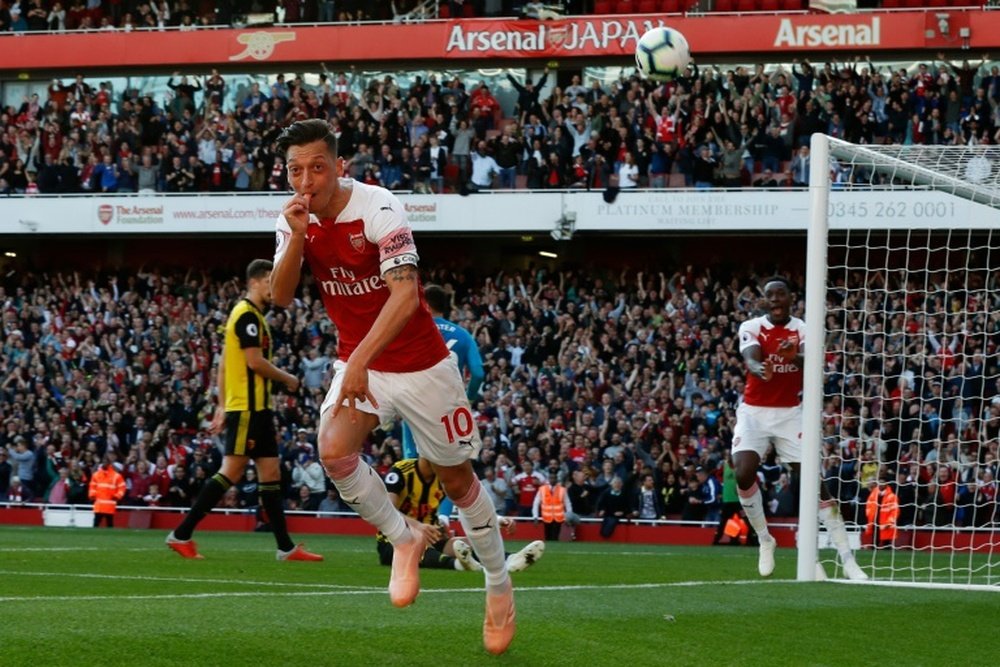 Ozil led Arsenal to victory on Monday night. AFP