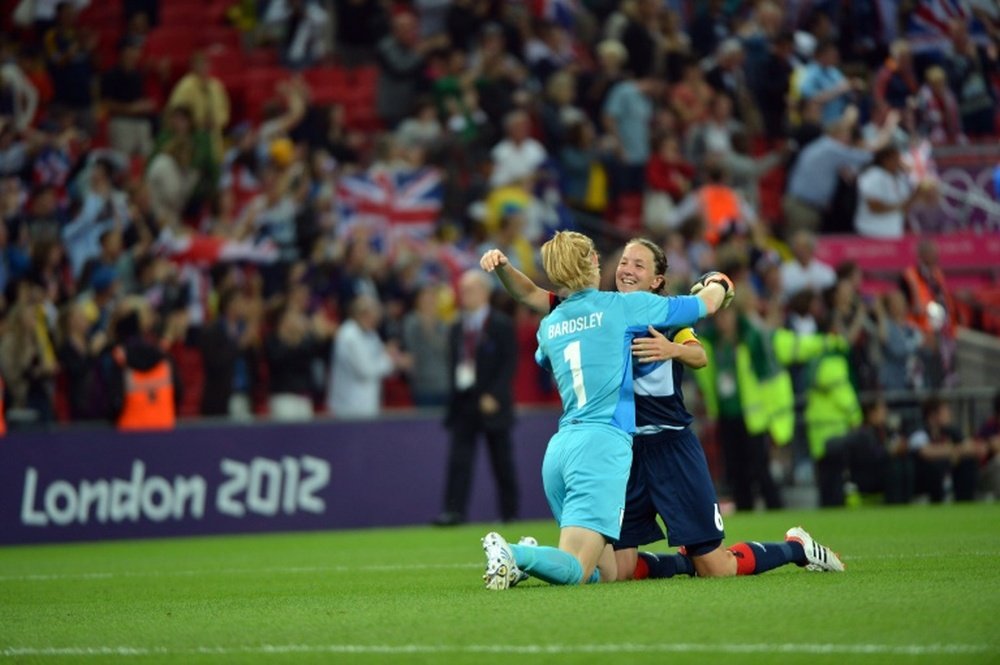 Casey Stoney (R) has joined Juan Mata's charity drive. AFP