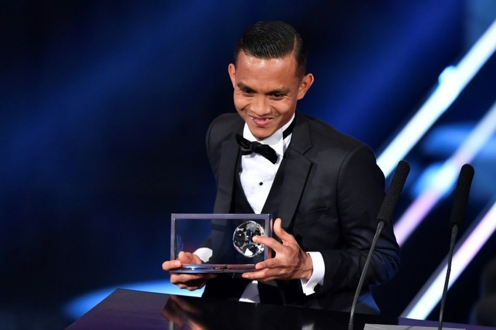 Penang FA and Malaysias midfielder Mohammed Faiz Subri holds his trophy. AFP