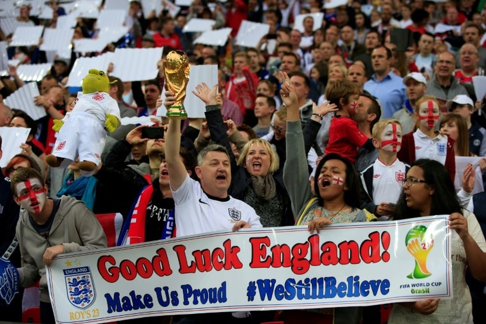 England fans cheer for their team during the international friendly football.