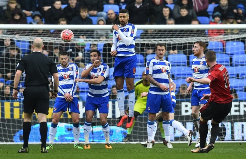 West Bromwich Albions midfielder Chris Brunt (R) takes a free kick during the FA cup fifth round football match between Reading and West Bromwich Albion on February 20, 2016