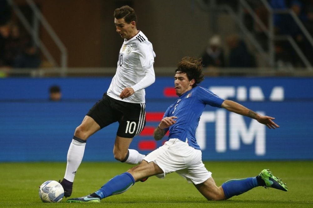 Italy defender Luca Antonelli (R) vies with Germanys defender Leon Goretzka. AFP