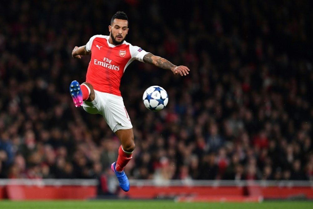 If Walcott moves to Everton in January, he may not be guaranteed a central striking role. AFP