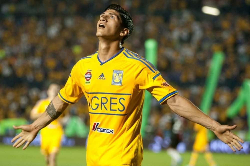 Tigres Alan Pulido celebrates after scoring against Atlas during their 2014 Mexican Clausura tournament football match in Monterrey, Mexico, on April 26,2014