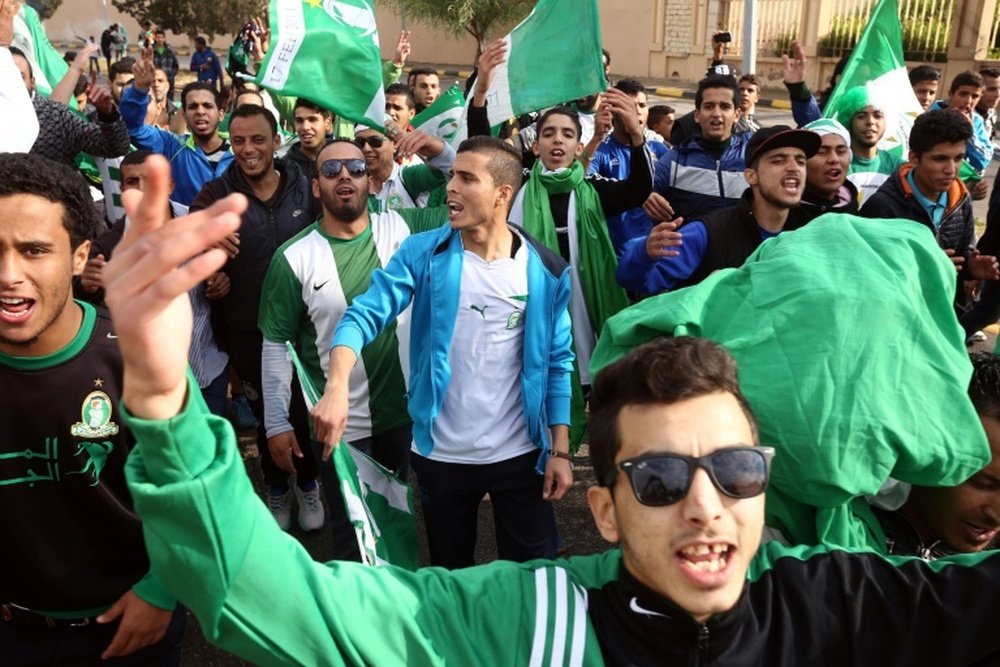 Libyans supporters arrive to attend the friendly football on December 15, 2015 at the International Stadium in the capital Tripoli