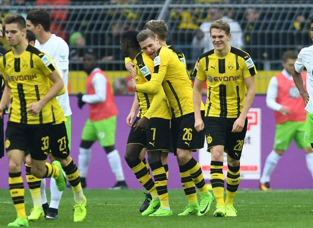 Les joueurs du Borussia Dortmund célèbrent un but contre Wolfsburg en Bundesliga. AFP