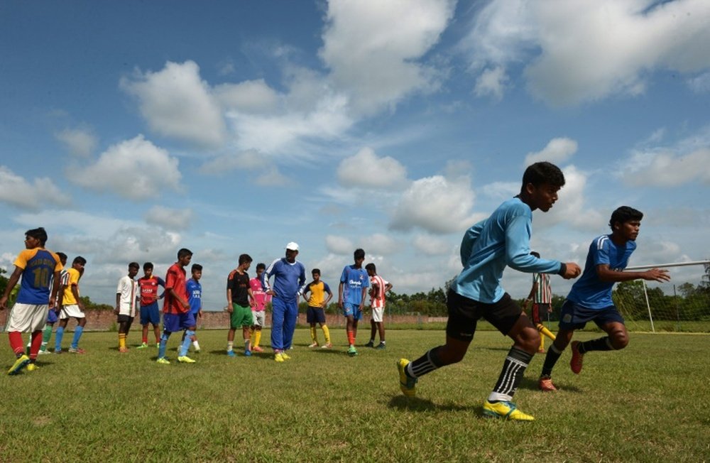 Under-privileged Indian schoolboys practice their football skills at The Durbar Sports Academy in Ramnagar